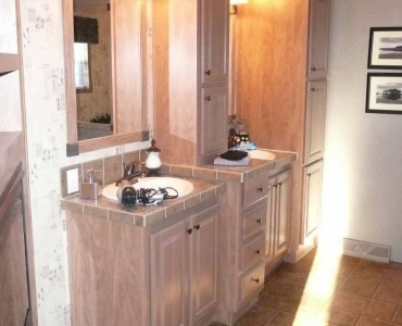Double vanity with linen cupboard