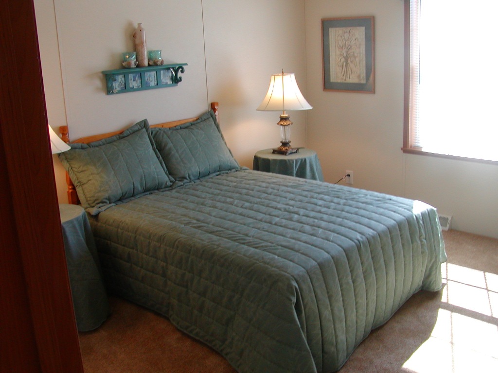bedroom with green bedding