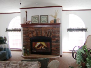 Stone fireplace with floor length windows