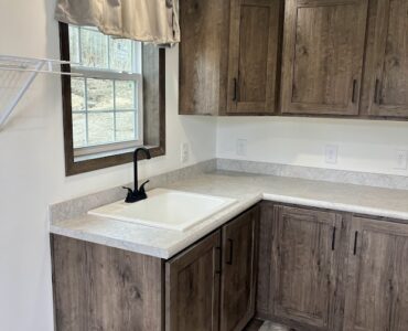 Utility Room with cabinets and sink