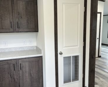 Utility Room with cabinets and sink